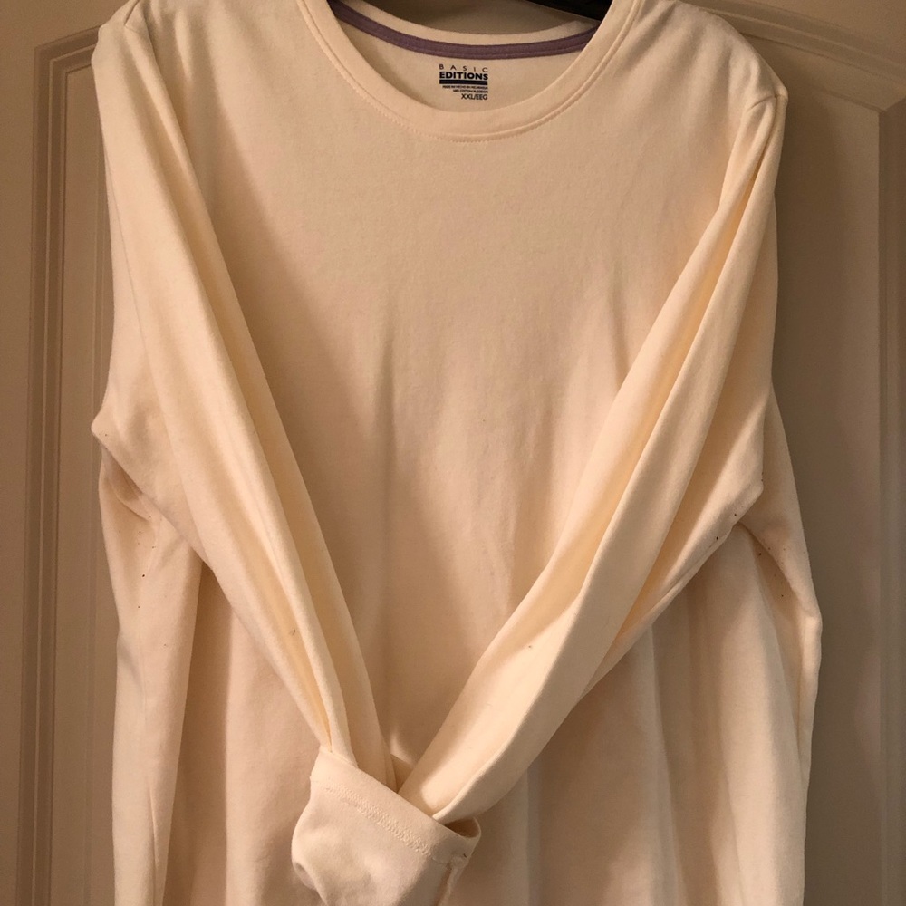 Cream colored crew neck long sleeved tee